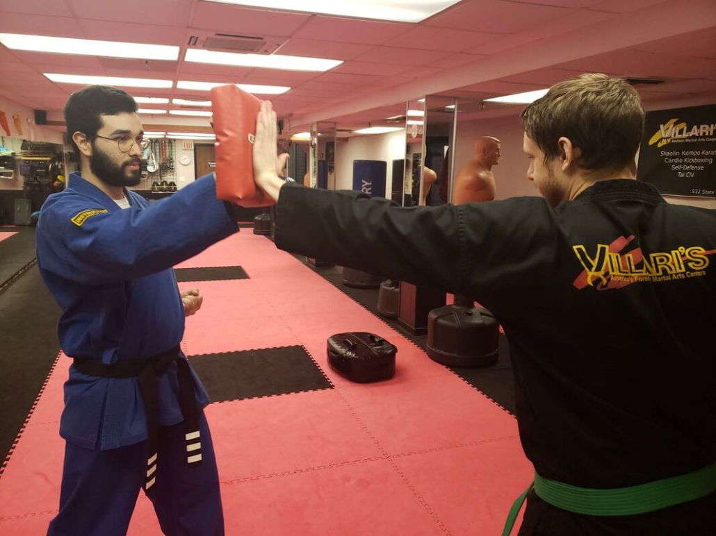 Men practicing self-defense moves at Underground Self-Defense Madison Wisconsin